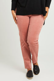 Model Monique wearing size 14 of The Keepers Cord Pull On Pant in colour Dustypink (Pink), from the front, cropped image