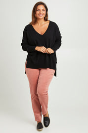 Model Monique wearing size 14 of The Keepers Cord Pull On Pant in colour Dustypink (Pink), from the front, showing the whole outfit