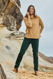 Model Amanda wearing size 10 of The Keepers Cord Pull On Pant in colour Forest (Green), from the front, showing the whole outfit