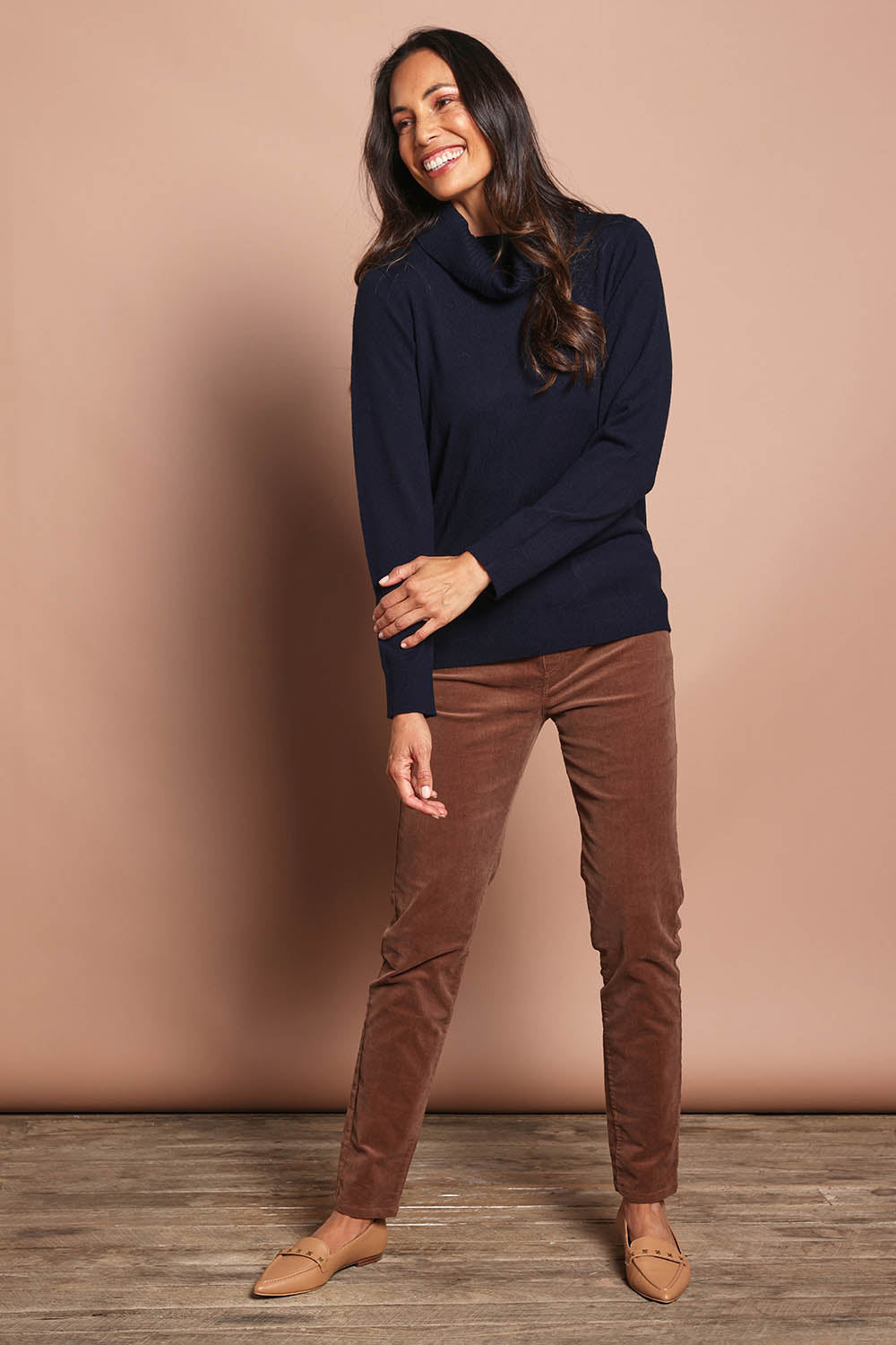 Model Amanda wearing size 10 of The Keepers Cord Pull On Pant in colour Mushroom, from the front, showing the whole outfit