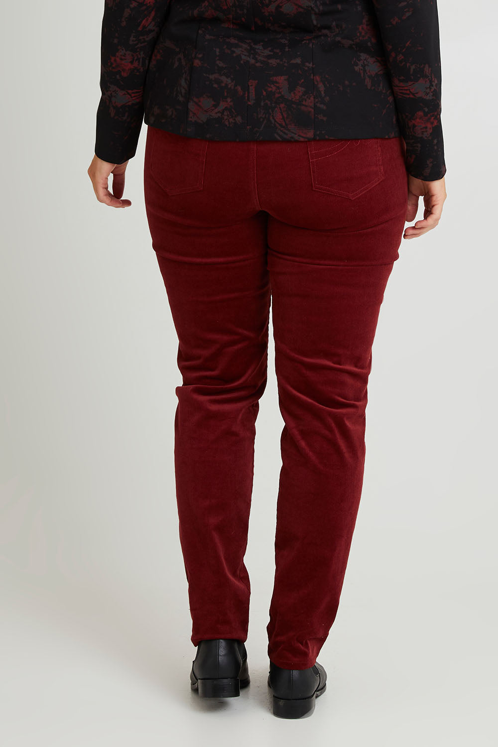 Model Laura wearing size 14 of The Keepers Cord Pull On Pant in colour Shiraz (Red), from the back