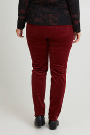 Model Laura wearing size 14 of The Keepers Cord Pull On Pant in colour Shiraz (Red), from the back