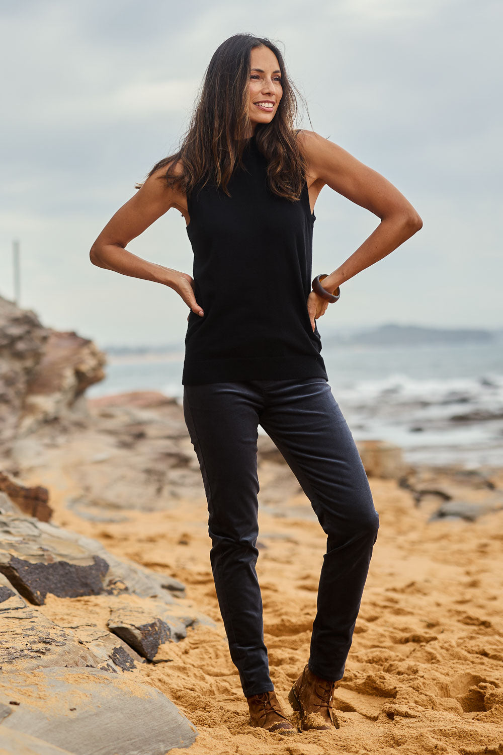 Model Amanda wearing size 10 of The Keepers Cord Pull On Pant in colour Slate (Grey), from the front, showing the whole outfit