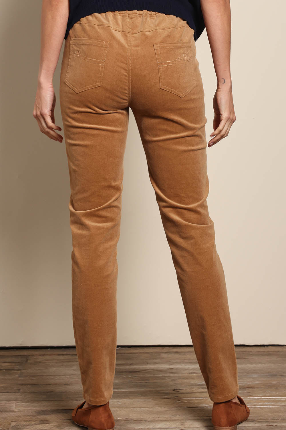 Model Amandam wearing size 10 of the The Keepers Cord Pull On Pant – Tan in colour Tan, from the back