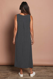 Model Amanda wearing size 10 of The Easy Wear Print Maxi Dress in colour Blackspot (Black), from the back