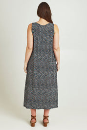 Model Jane wearing size 14 of The Easy Wear Print Maxi Dress in colour Multiprint (Blue), from the back