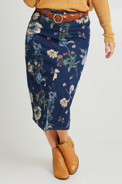 Model Laura wearing size 14 of The 5 Pocket Printed Midi Skirt in colour Softfloral (Blue), from the front, cropped image