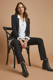 Model Madeline wearing size 10 of The Ponte Pinstitch Pull On Pant in colour Black (Black), from the front, showing the whole outfit
