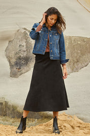 Model Amanda wearing size 10 of The Luxe Faux Suede Skirt in colour Black (Black), from the front, showing the whole outfit