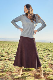 Model Amanda wearing size 10 of The Luxe Faux Suede Skirt in colour Burgundy (Purple), from the front, showing the whole outfit