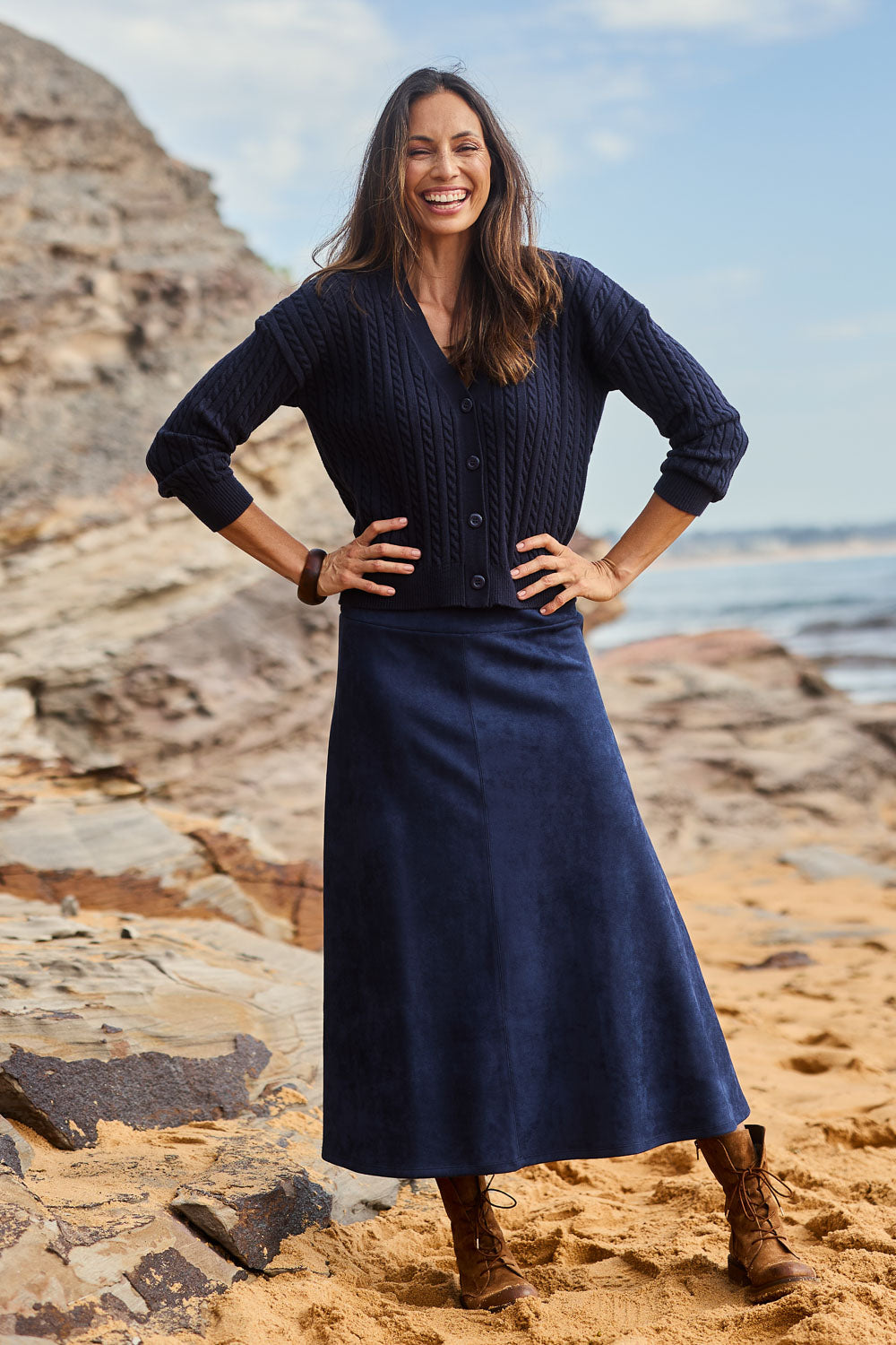 Model Amanda wearing size 10 of The Luxe Faux Suede Skirt in colour Navy (Blue), from the front, showing the whole outfit