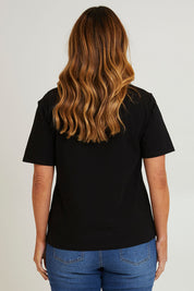 Model Laura wearing size 14 of The Keepers Square Neck Tee in colour Black (Black), from the back