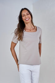 Model Amanda wearing size 10 of The Keepers Square Neck Tee in colour Latte, from the front, showing the whole outfit