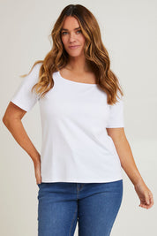 Model Laura wearing size 14 of The Keepers Square Neck Tee in colour White (White), from the front, cropped image