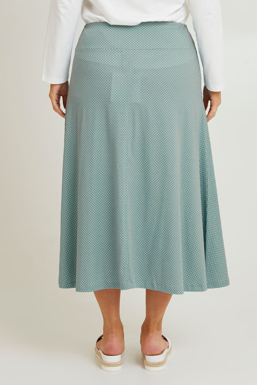 Model Laura wearing size 14 of The Bamboo Blend Print Fit & Flare Skirt in colour Aquaspot (Green), from the front, cropped image