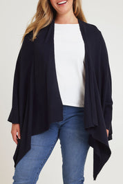 Model Chanel wearing The Every Season Poncho in colour Darknavy (Blue), from the front, cropped image