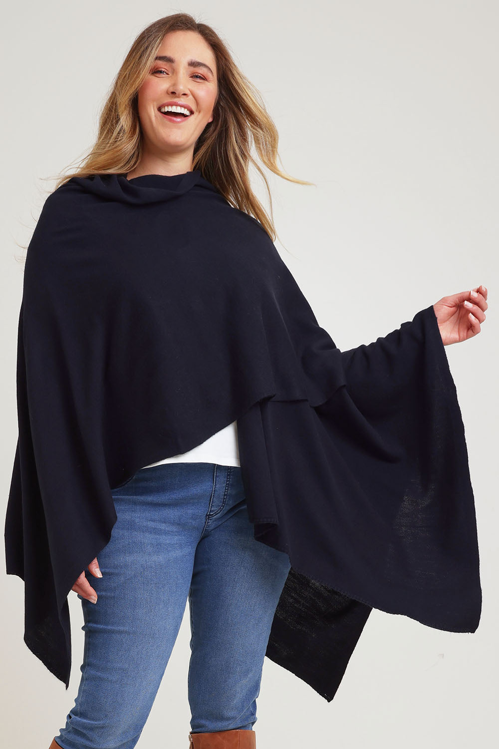 Model Chanel wearing The Every Season Poncho in colour Darknavy (Blue), from the front, cropped image