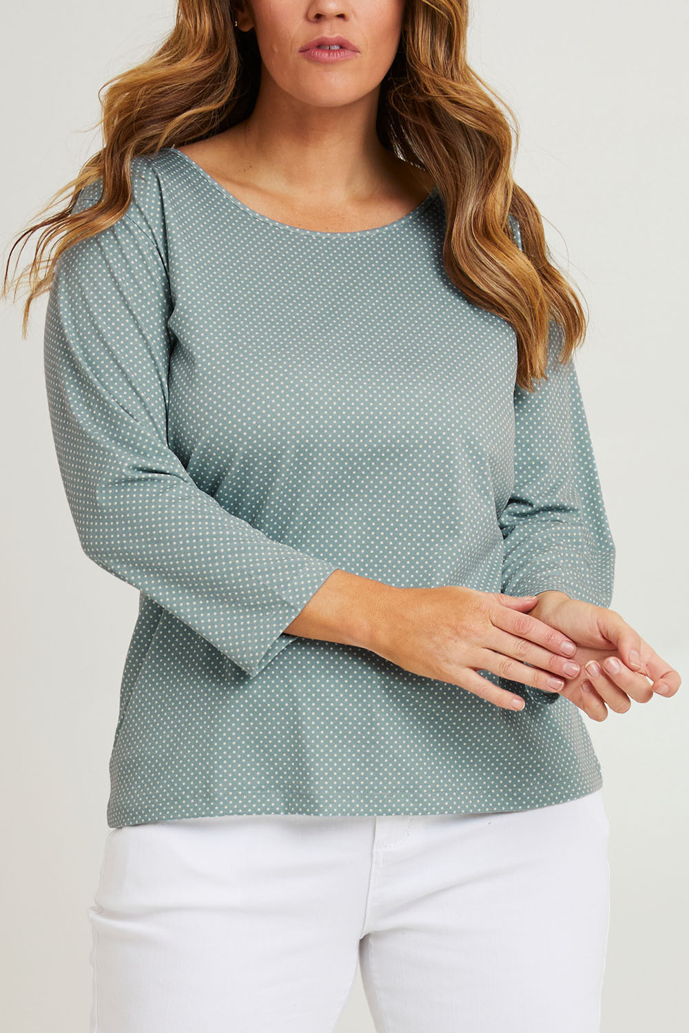 Model Laura wearing size 14 of The Bamboo Blend Printed 3/4 Slv Tee in colour Aquaspot (Green), from the front, cropped image