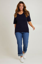 Model Laura wearing size L of The All Season Crew Neck Knit Tee in colour Clasicnavy (Blue), from the front, showing the whole outfit