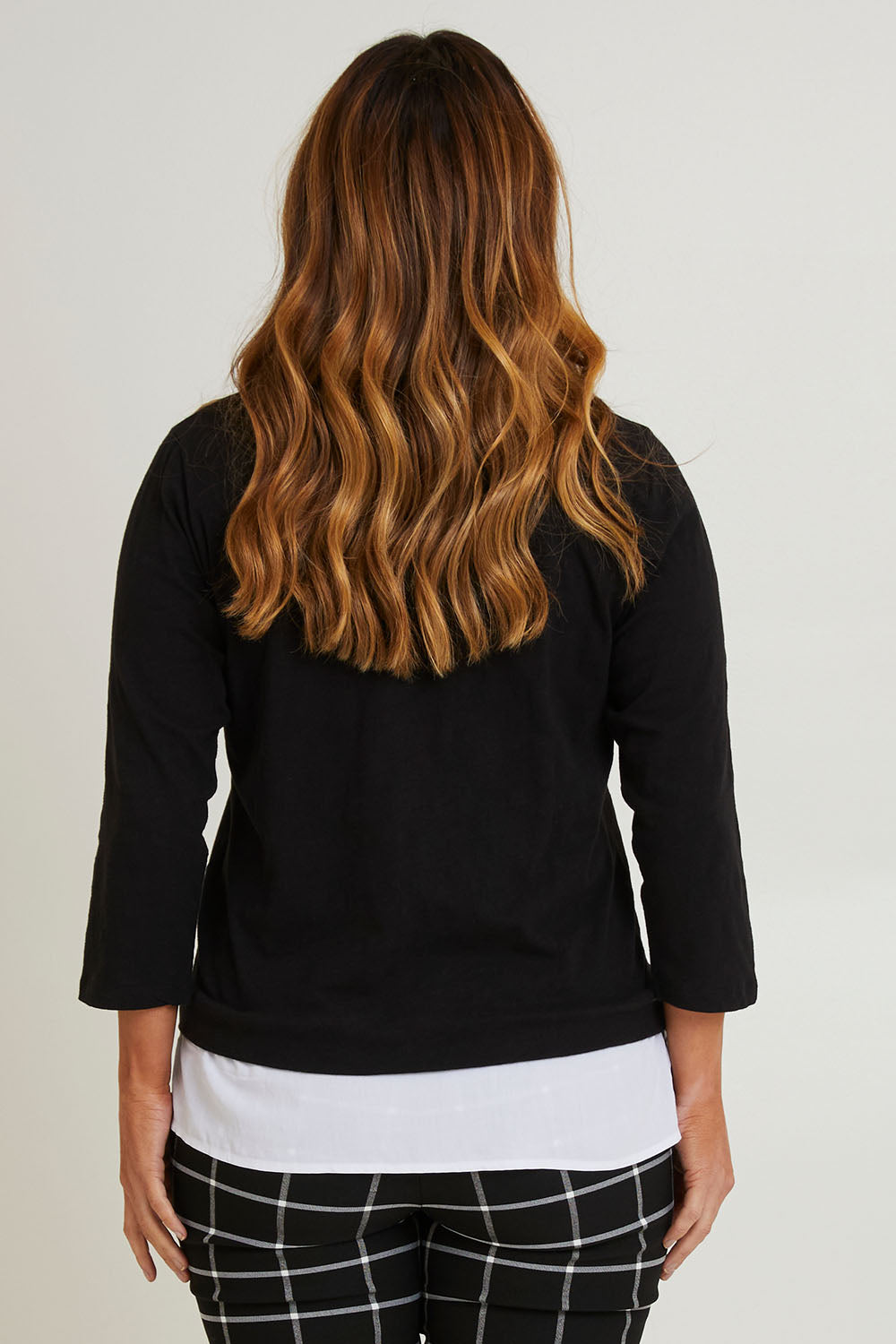 Model Laura wearing size 14 of The Keepers Layered Tee in colour Black (Black), from the back
