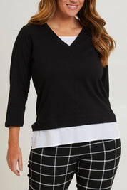 Model Laura wearing size 14 of The Keepers Layered Tee in colour Black (Black), from the front, cropped image