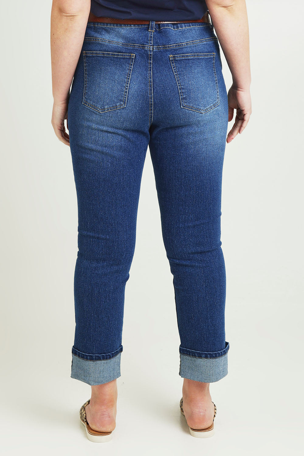 Model Jane wearing size 14 of The High Waisted Cuff Jean in colour Mediumblue (Blue), from the back