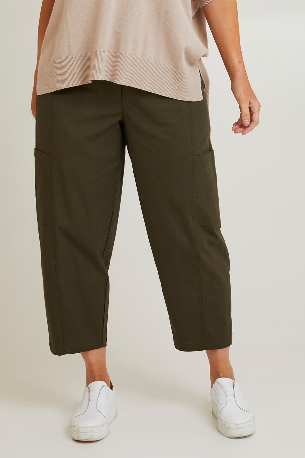 Model Laura wearing size 14 of The Keepers Side Pocket Pant in colour Armygreen (Green), from the front, cropped image