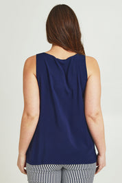 Model Jane wearing size 14 of The Keepers Essential Woven Tank in colour Navy (Blue), from the back