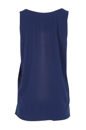 Product shot of The Keepers Essential Woven Tank in colour Navy (Blue), from the back
