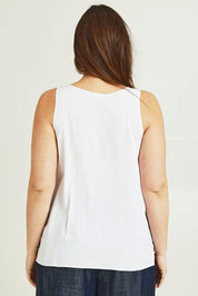 Model Jane wearing size 14 of The Keepers Essential Woven Tank in colour White (White), from the back
