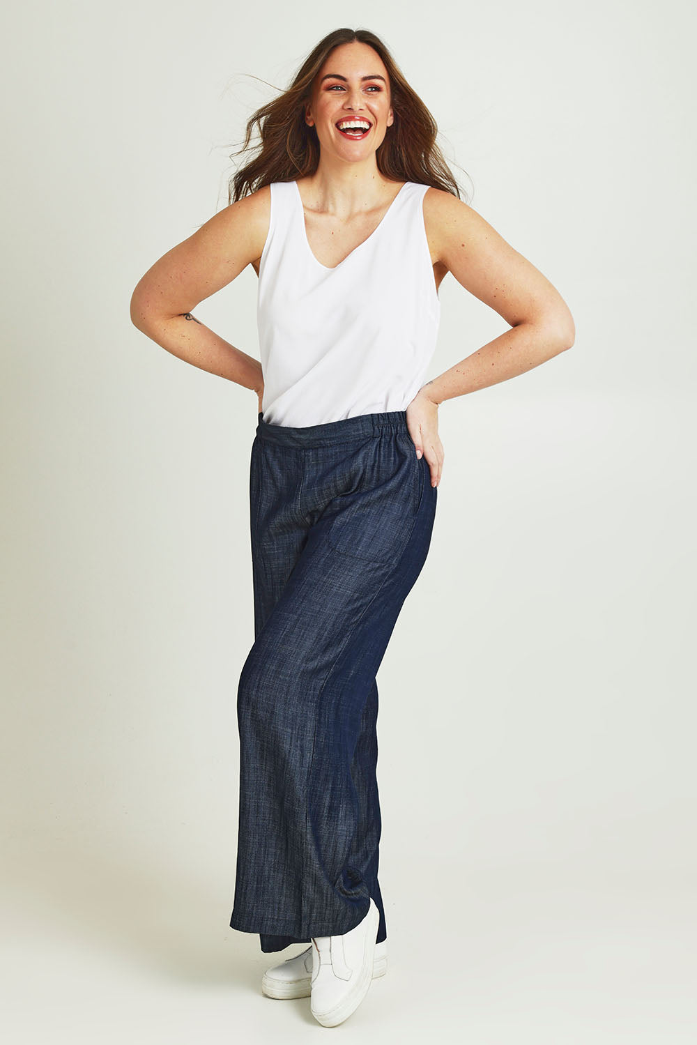 Model Jane wearing size 14 of The Keepers Essential Woven Tank in colour White (White), from the front, showing the whole outfit