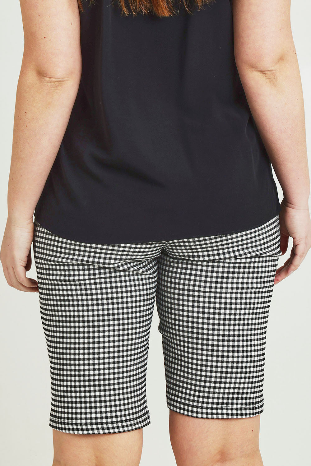 Model Jane wearing size 14 of The Keepers Check Cotton Short in colour Blackwhite (Black), from the back