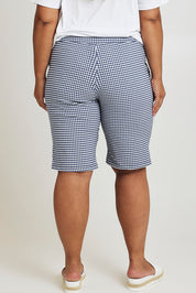 Model Ashleigh wearing size 16 of The Keepers Check Cotton Short in colour Navywhite (Blue), from the back