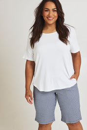 Model Ashleigh wearing size 16 of The Keepers Check Cotton Short in colour Navywhite (Blue), from the front, cropped image