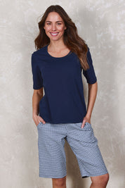 Model Madeline wearing size 10 of The Keepers Check Cotton Short in colour Navywhite (Blue), from the front, showing the whole outfit