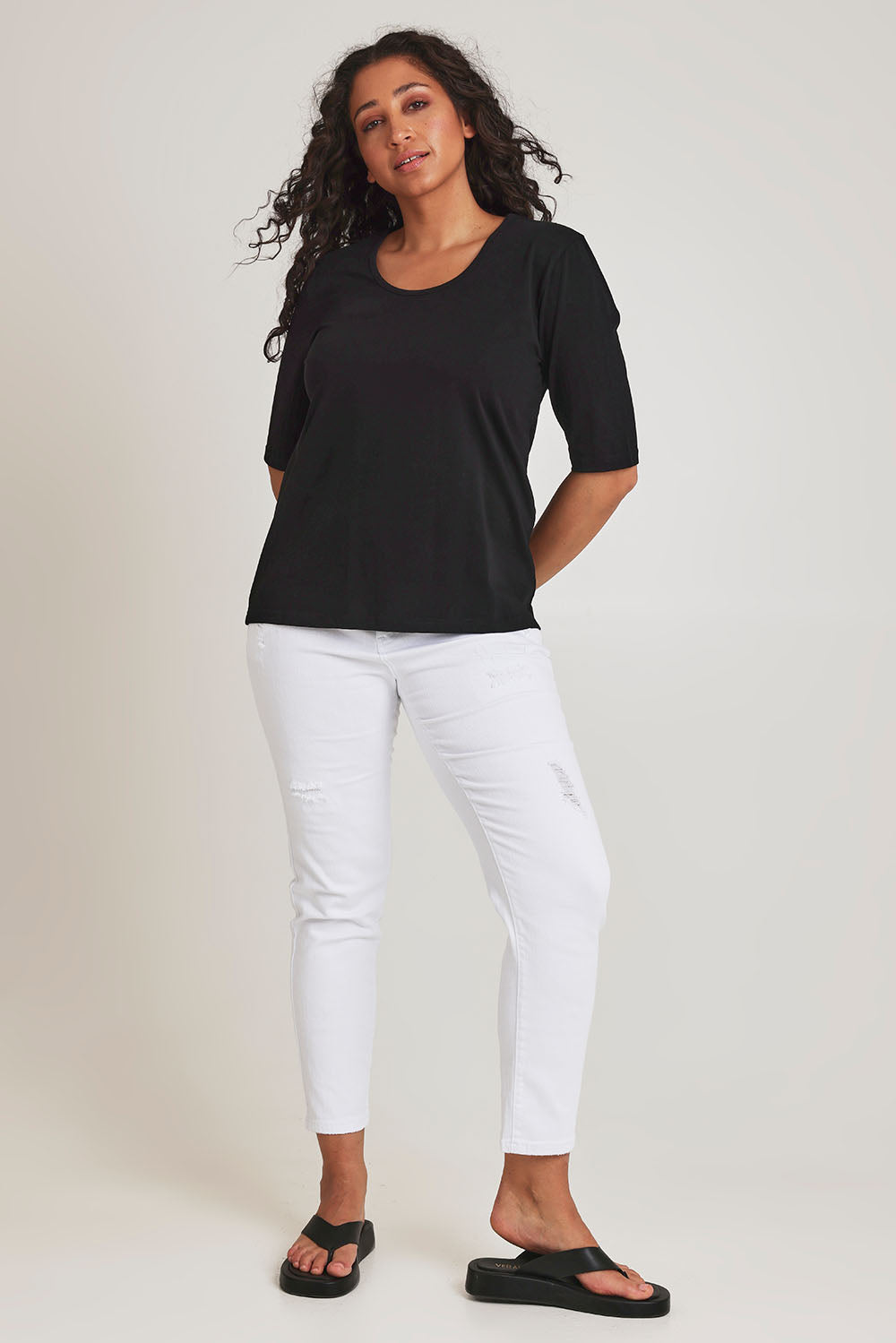 Model Terri-Leigh wearing size 14 of The Luxe Pima Cotton Tee in colour Black (Black), from the front, showing the whole outfit