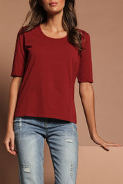 Model Madeline wearing size 10 of The Luxe Pima Cotton Tee in colour Deeprose (Pink), from the front, cropped image