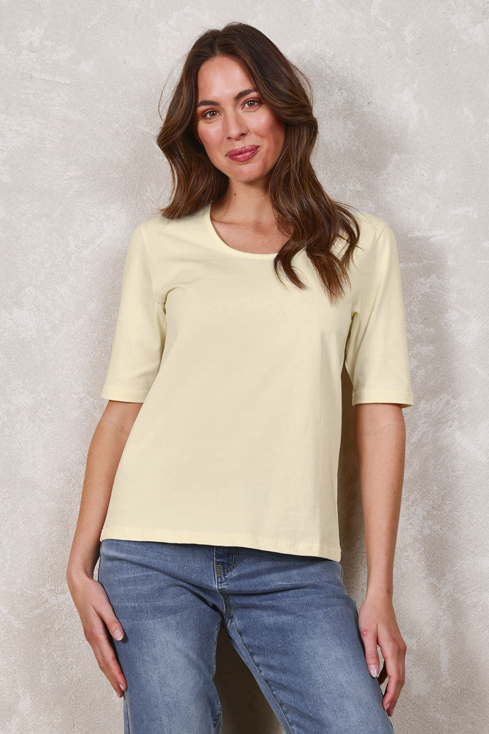 Model Madeline wearing size 10 of The Luxe Pima Cotton Tee in colour Lemon, from the front, showing the whole outfit