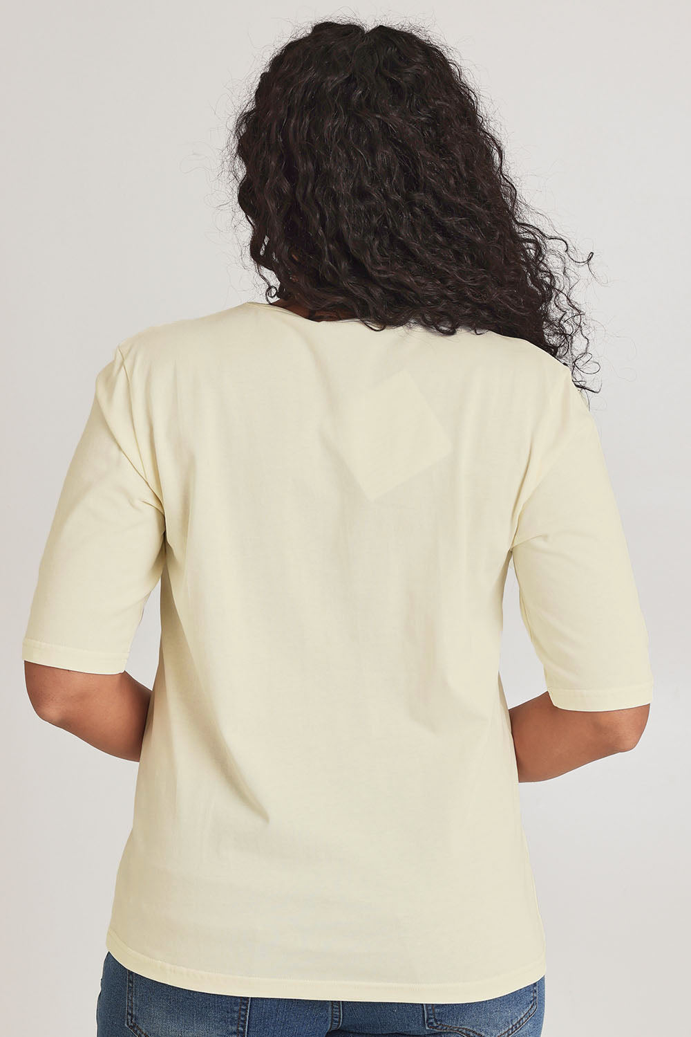 Model Terri-Leigh wearing size 14 of The Luxe Pima Cotton Tee in colour Lemon, from the back