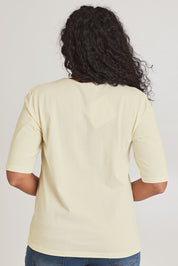 Model Terri-Leigh wearing size 14 of The Luxe Pima Cotton Tee in colour Lemon, from the back