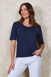 Model Madeline wearing size 10 of The Luxe Pima Cotton Tee in colour Navy (Blue), from the front, showing the whole outfit