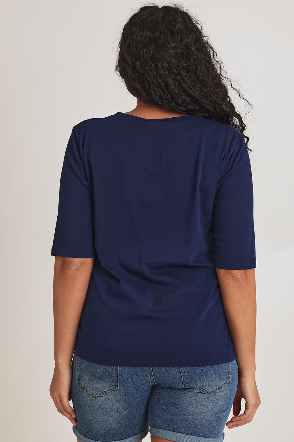 Model Terri-Leigh wearing size 14 of The Luxe Pima Cotton Tee in colour Navy (Blue), from the back