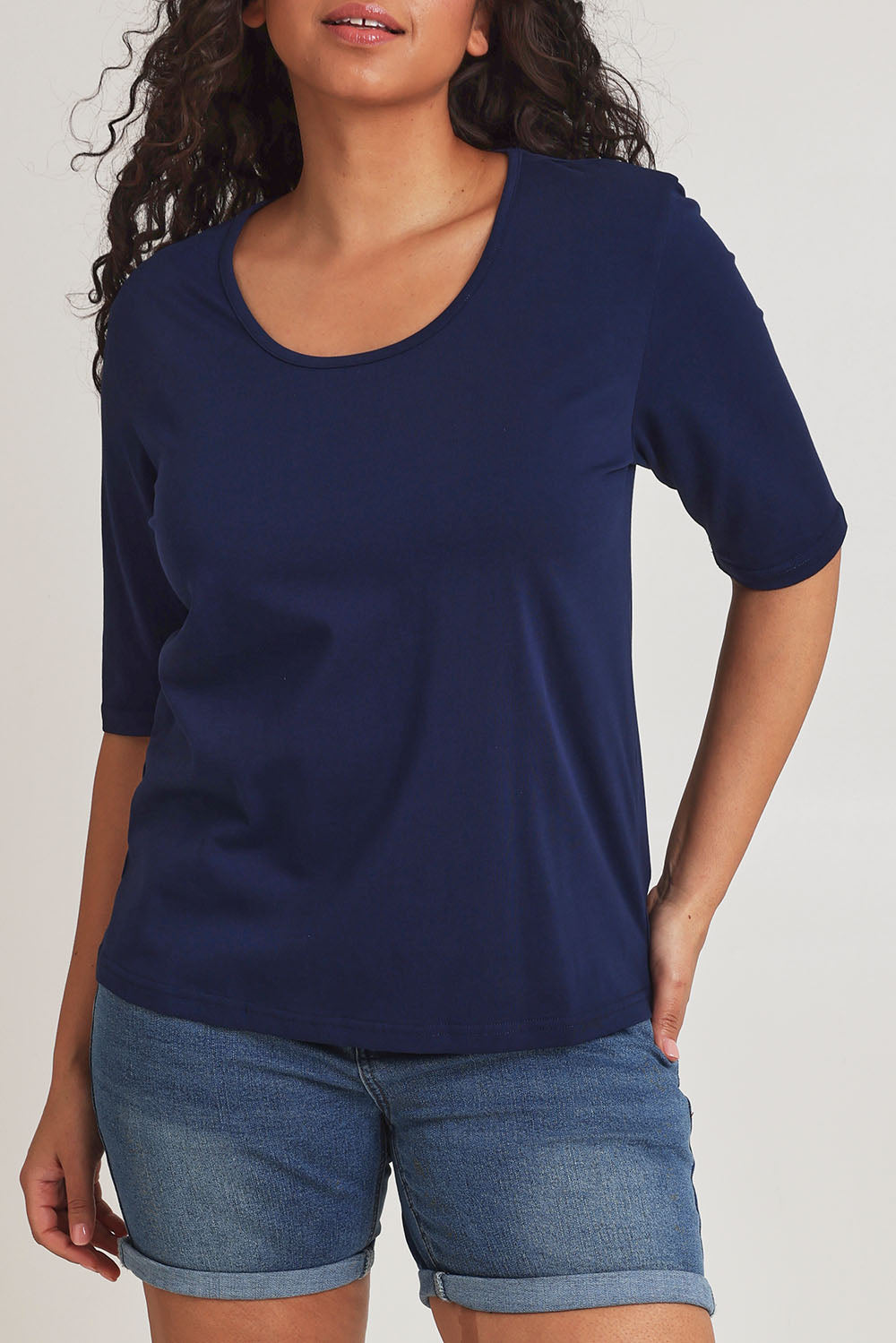 Model Terri-Leigh wearing size 14 of The Luxe Pima Cotton Tee in colour Navy (Blue), from the front, cropped image