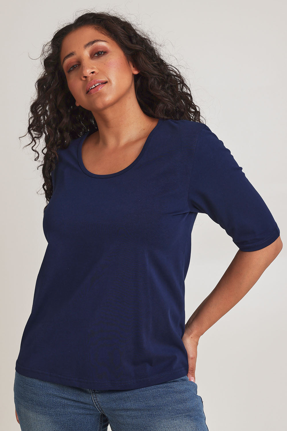 Model Terri-Leigh wearing size 14 of The Luxe Pima Cotton Tee in colour Navy (Blue), from the front, cropped image