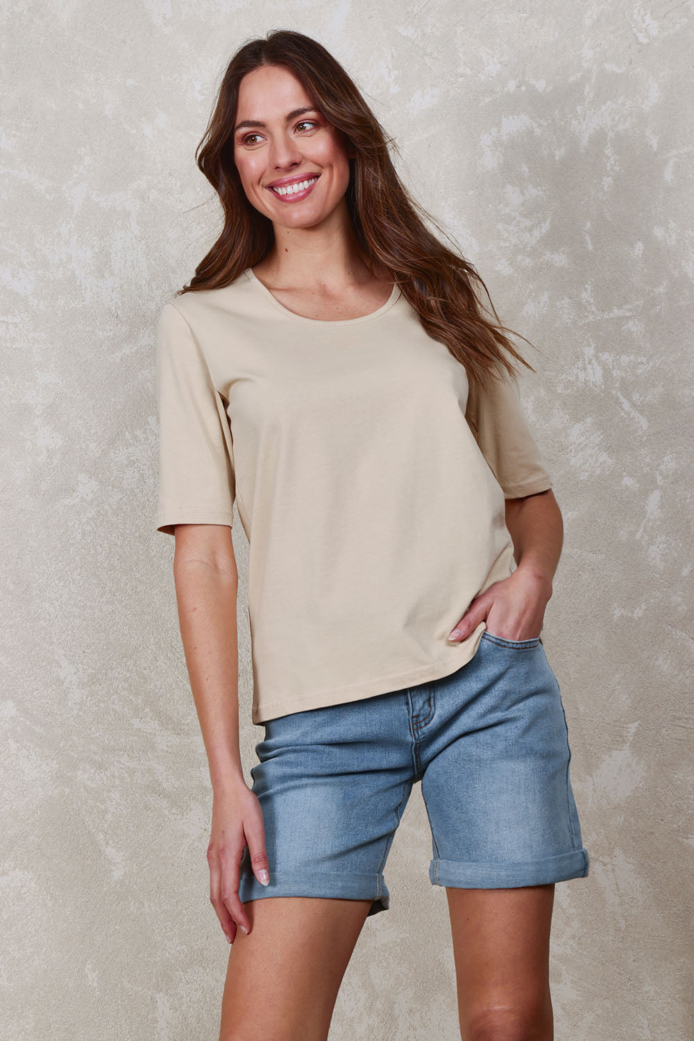 Model Madeline wearing size 10 of The Luxe Pima Cotton Tee in colour Nougat, from the front, showing the whole outfit