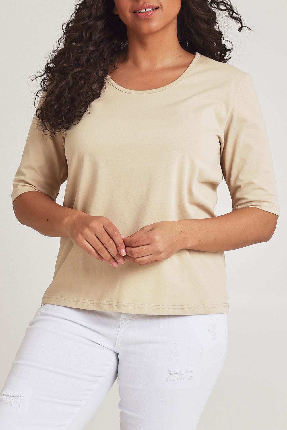 Model Terri-Leigh wearing size 14 of The Luxe Pima Cotton Tee in colour Nougat, from the front, cropped image