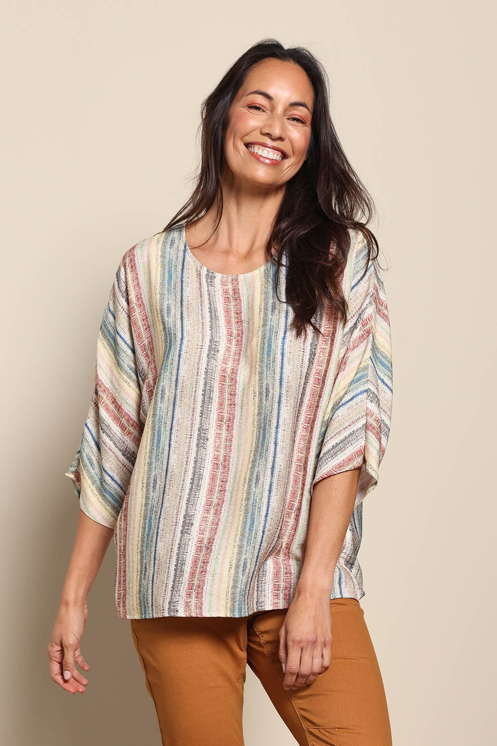Model Amandam wearing size 10 of the The Woven Easy Wear Tee – Multistrip in colour Multistrip, in a cropped view