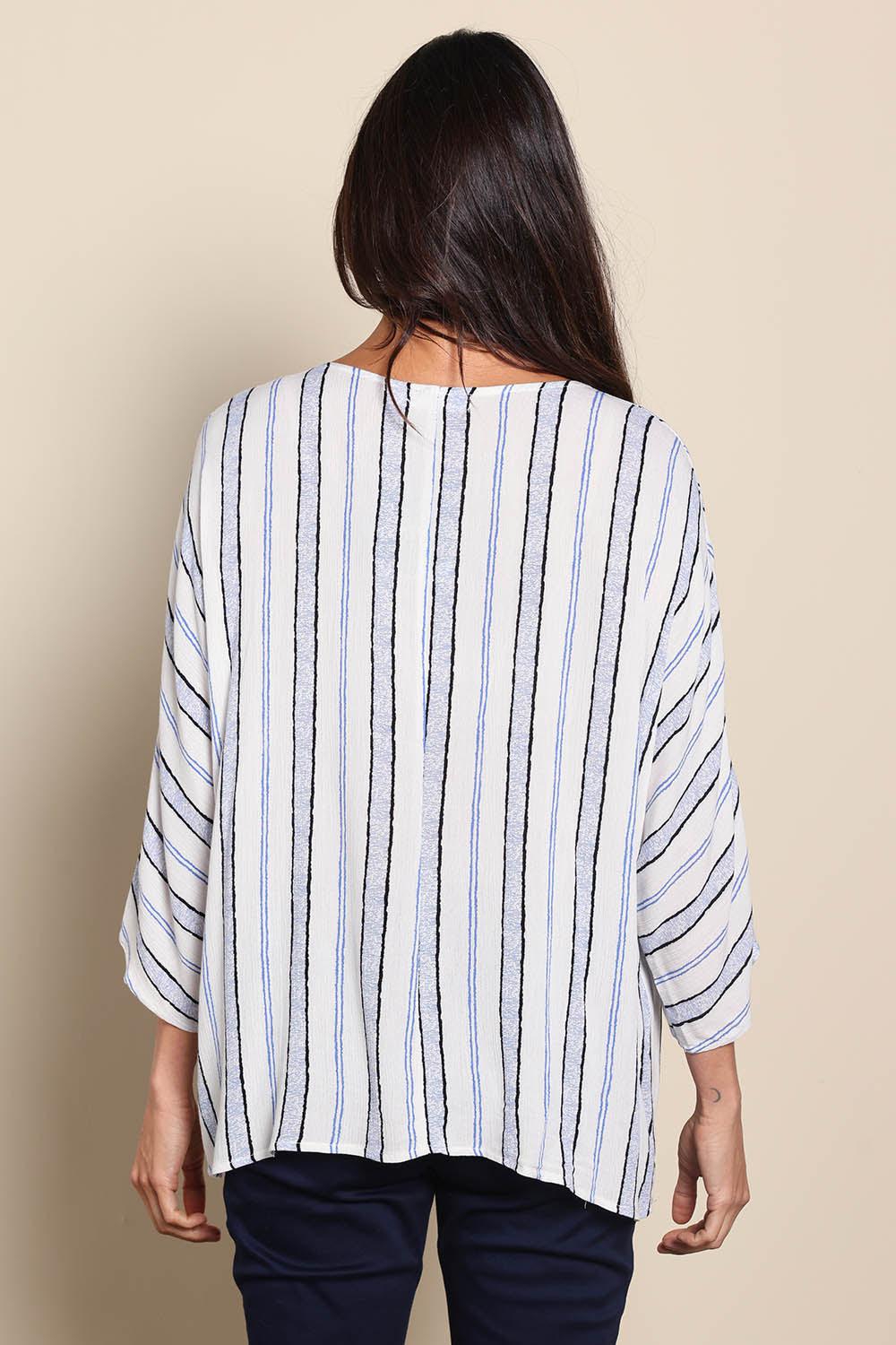 Model Amandam wearing size 10 of the The Woven Easy Wear Tee – Bluewhite in colour Bluewhite, from the back