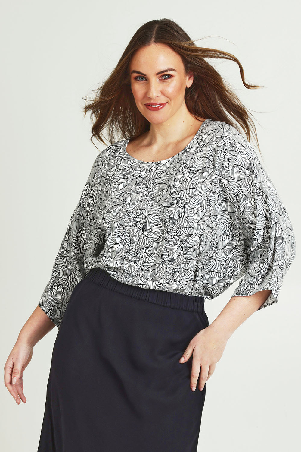 Model Jane wearing size 14 of The Woven Easywear Tee in colour Blackwhite (White), from the front, cropped image