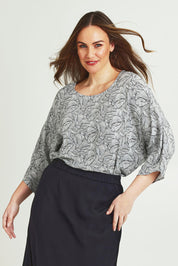 Model Jane wearing size 14 of The Woven Easywear Tee in colour Blackwhite (White), from the front, cropped image